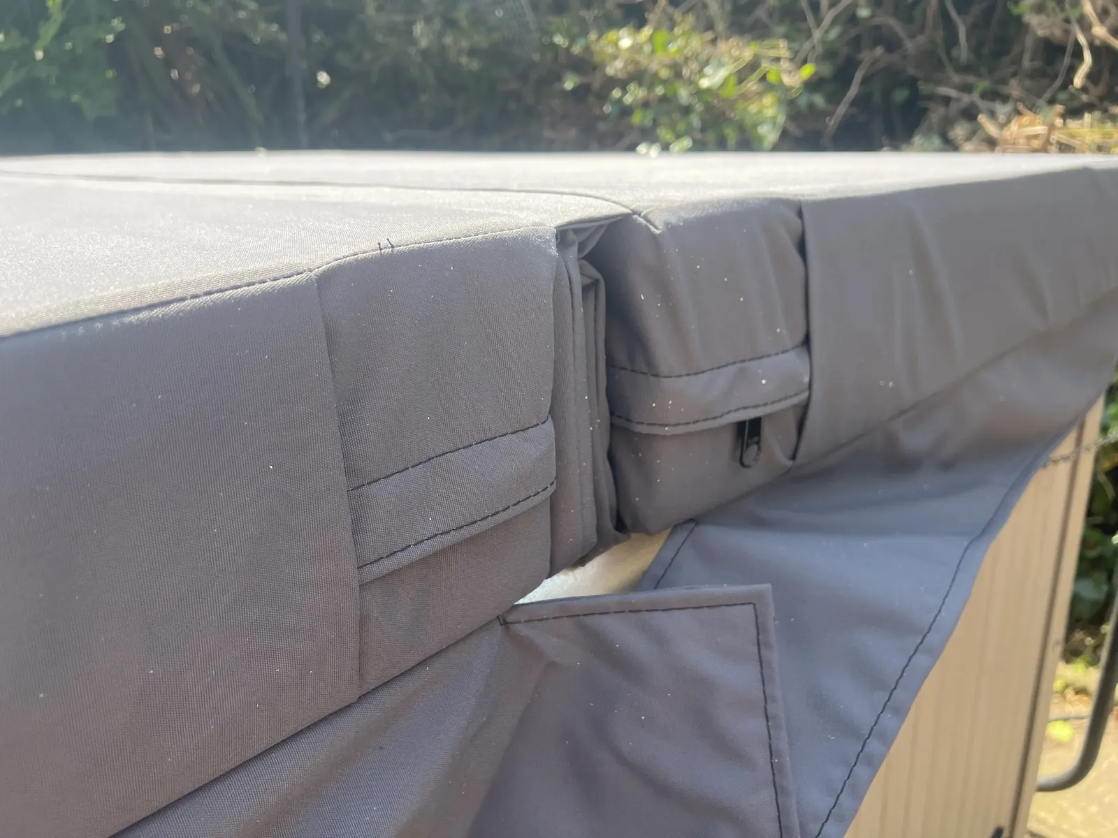 Skirt and strap detail on a WeatherTech fabric hot tub cover